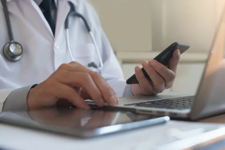 Doctor getting ready to call an interpreter