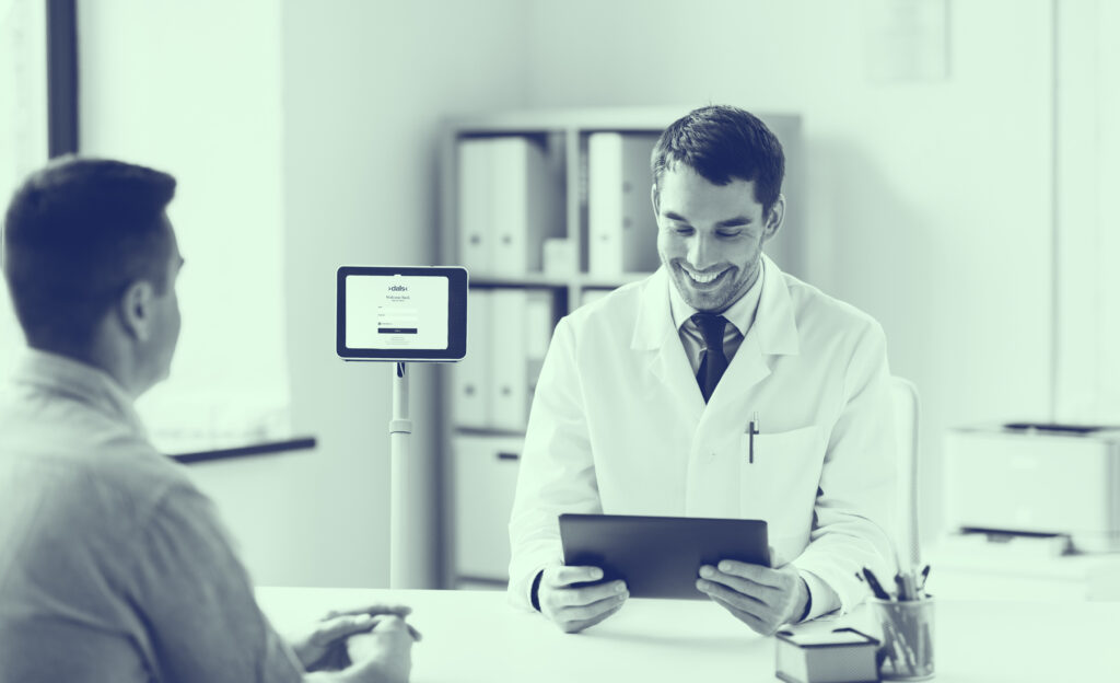 Doctor and Patient using the technology Tablet on Wheels to understand each other